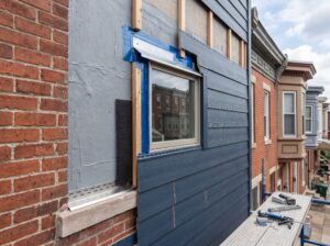 Preventing Water Intrusion Behind Fiber Cement Siding on Philadelphia Homes shown in a realistic Philadelphia, PA residential construction setting.